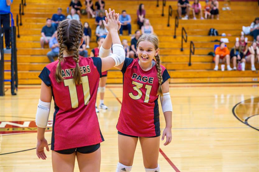 Student-athletes play volleyball